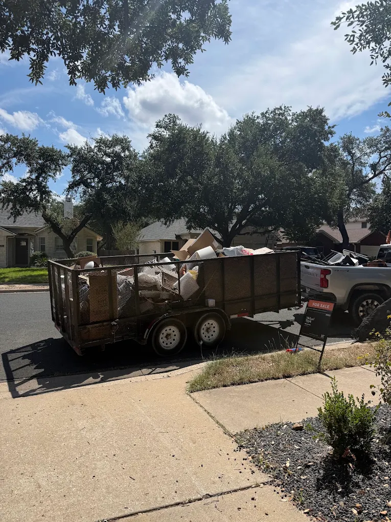 Trailer loaded with furniture and household junk